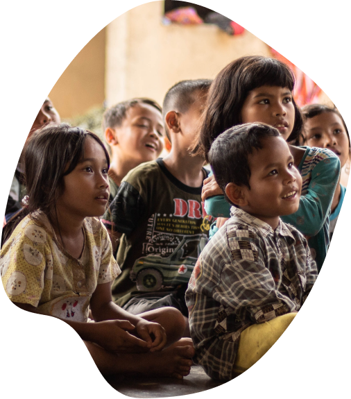 Children listening to a presentation and laughing